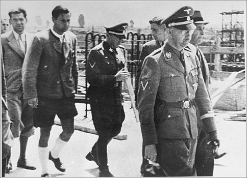 Reichsfuehrer SS Heinrich Himmler tours the Monowitz-Buna building site in the company of Max Faust (far right, next to Himmler